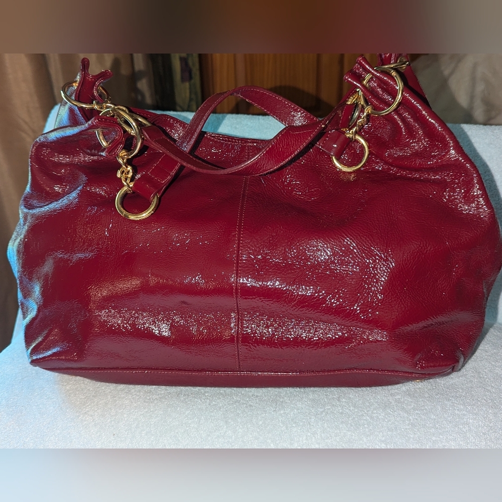 Hobo International red patent leather shoulder bag.